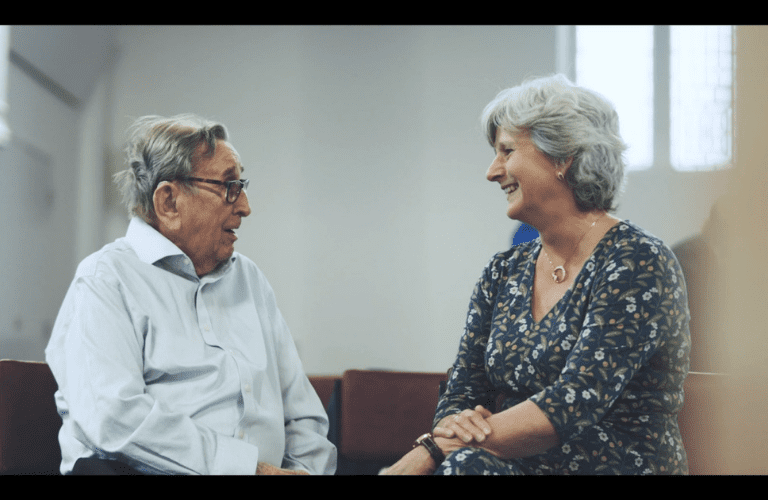 Colin talking to Admiral Nurse Loraine Butterworth indoors