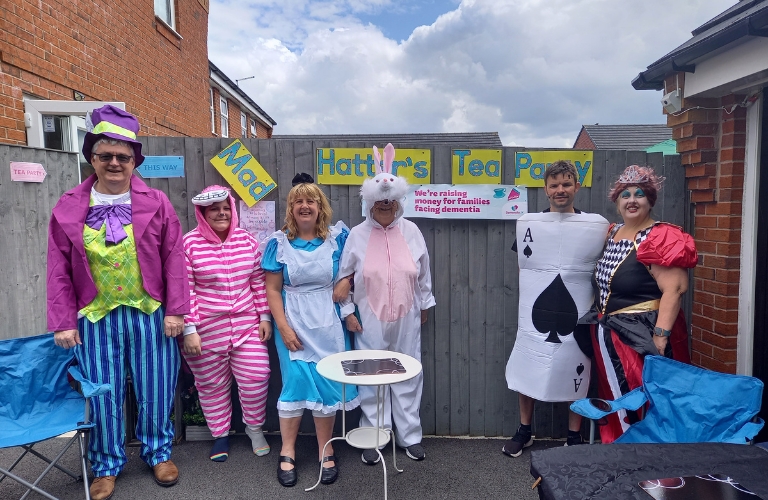 A Time for a Cuppa fundraising event, with all the participants dressed as characters from Alice in Wonderland.