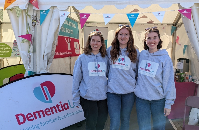 Three dementia UK volunteers at an event