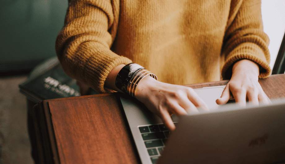 Woman typing on a laptop