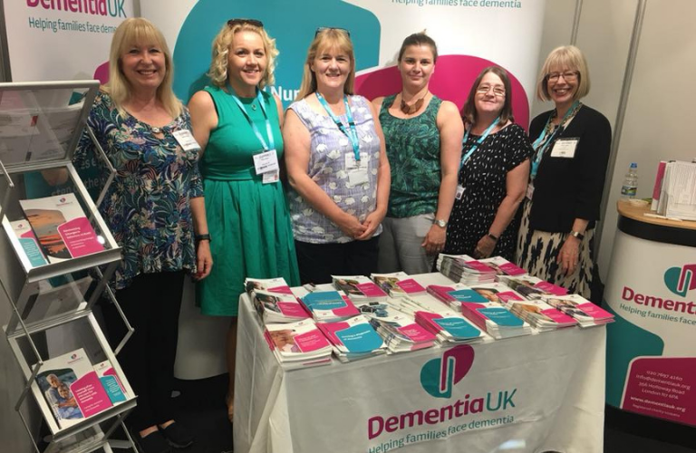 Hilda Hayo standing with five Admiral Nurses at the Dementia UK stand at the Alzheimer's show