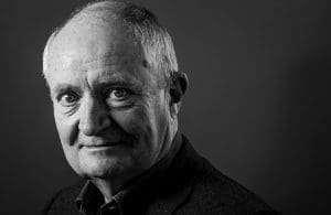 black and white headshot of Jim Broadbent