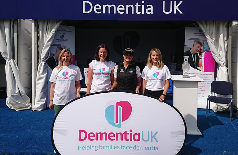 four supporters at the dementia uk stand
