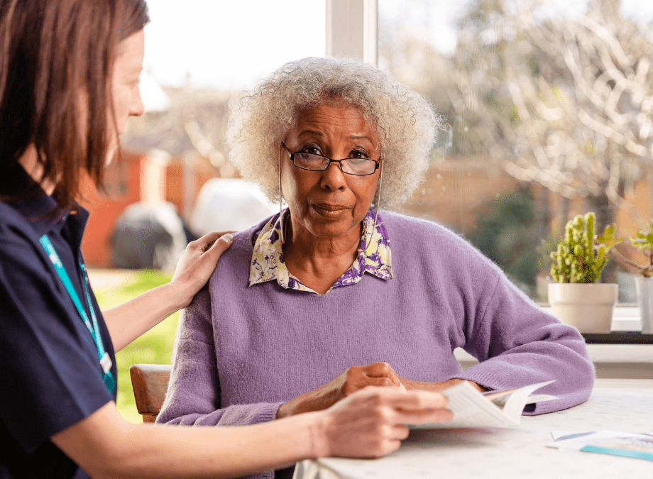 Older woman talking to Hannah, Admiral Nurse