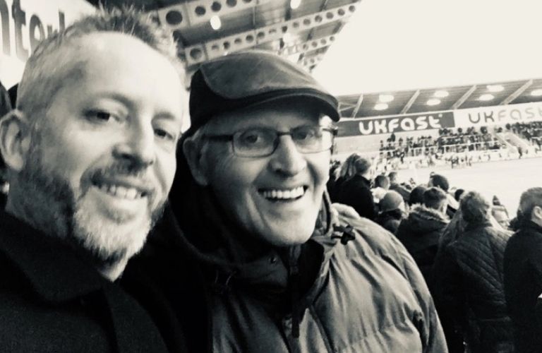 Neil and his Dad david at a football match