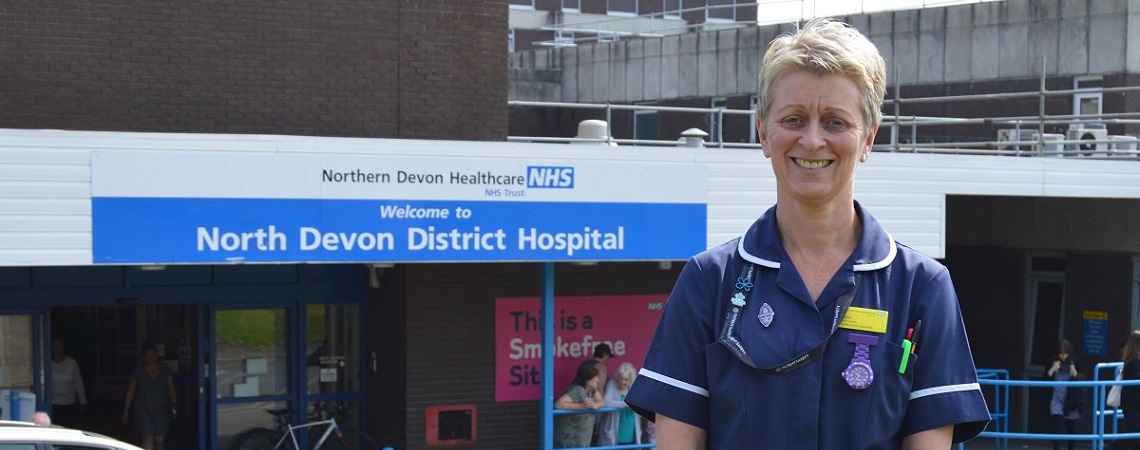 Admiral Nurse Angela standing in front of North Devon District Hospital