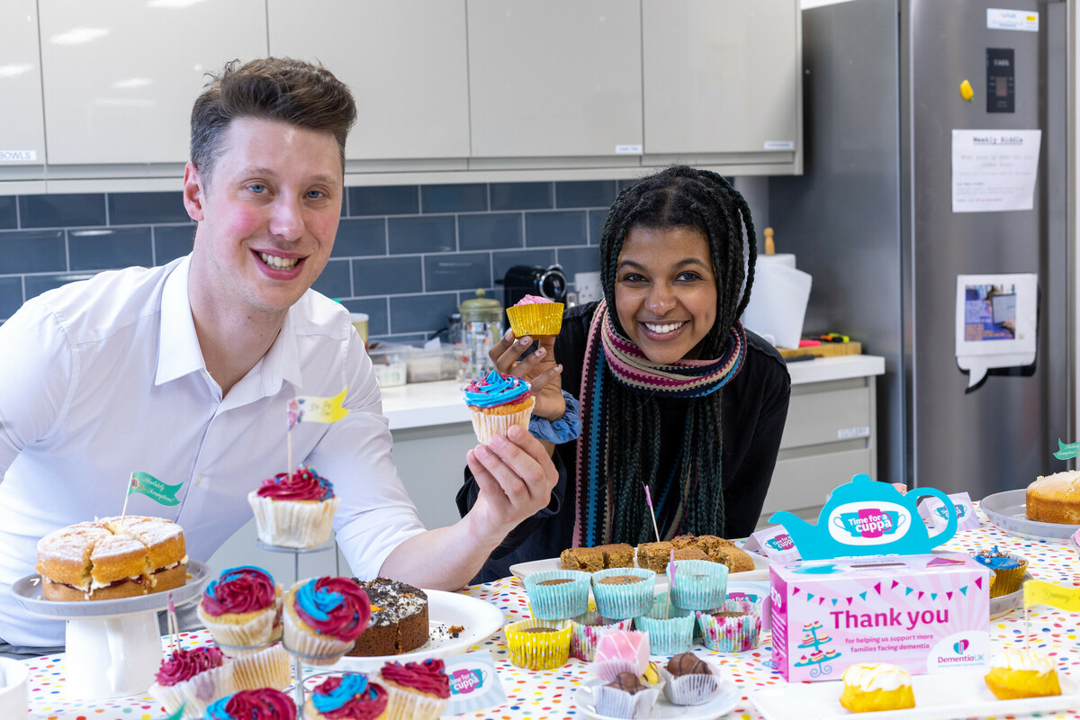 Reem, Individual Giving Assistant and Iain, take part in Dementia UK's office tea party in London, March 2023.