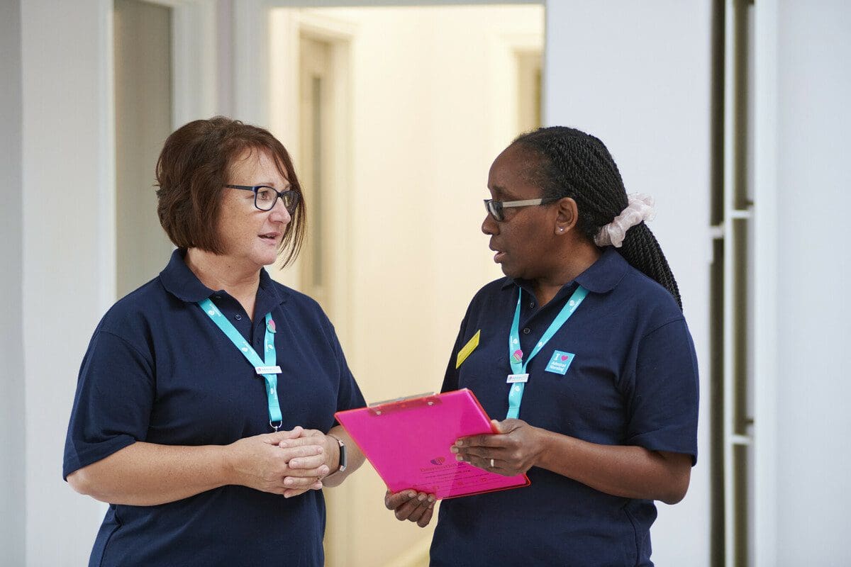 Diane and Roxanne, Admiral Nurses, in a clinical setting