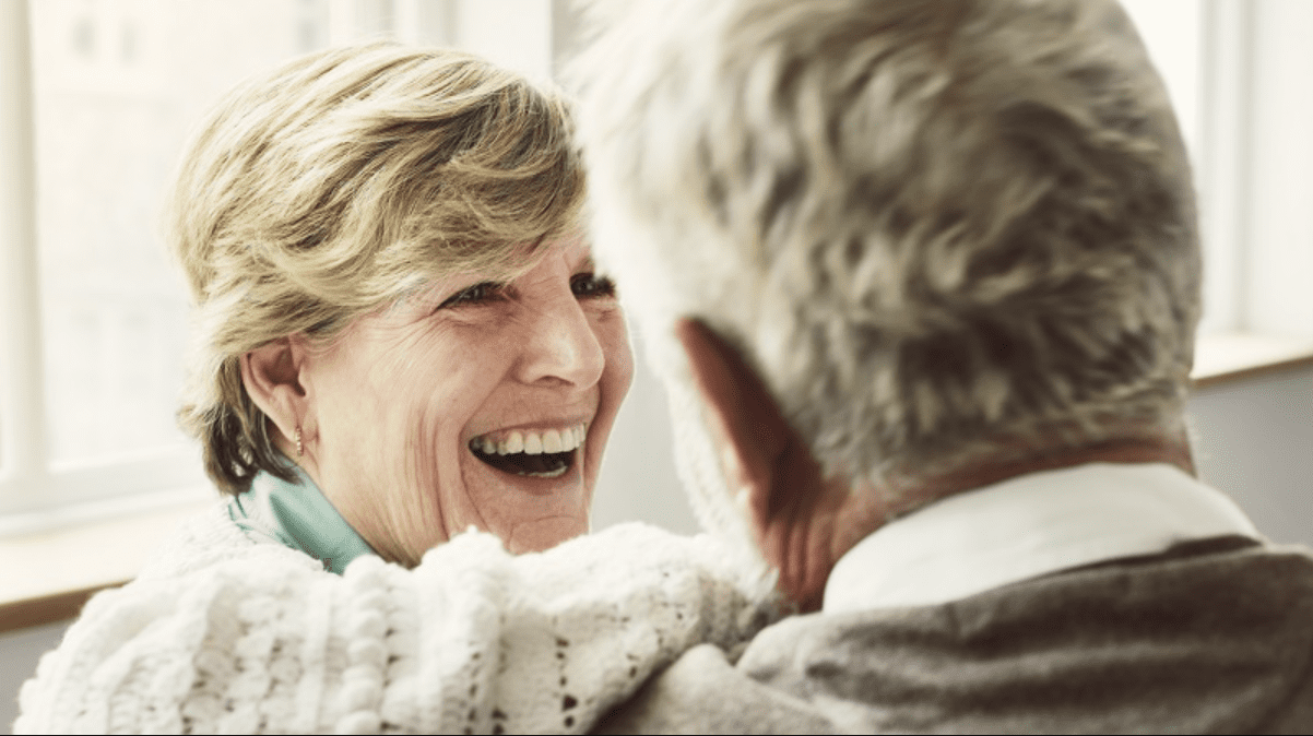 An older couple laughing