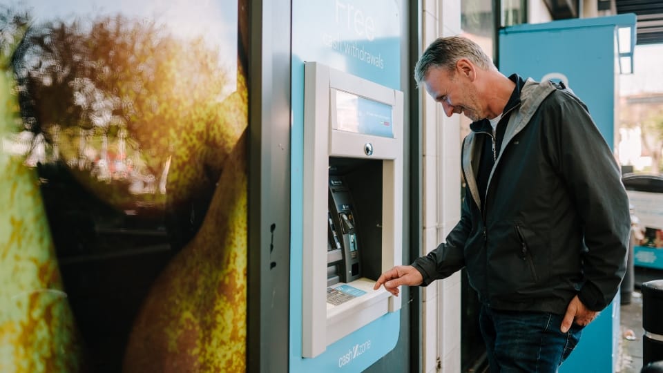 a man using an ATM