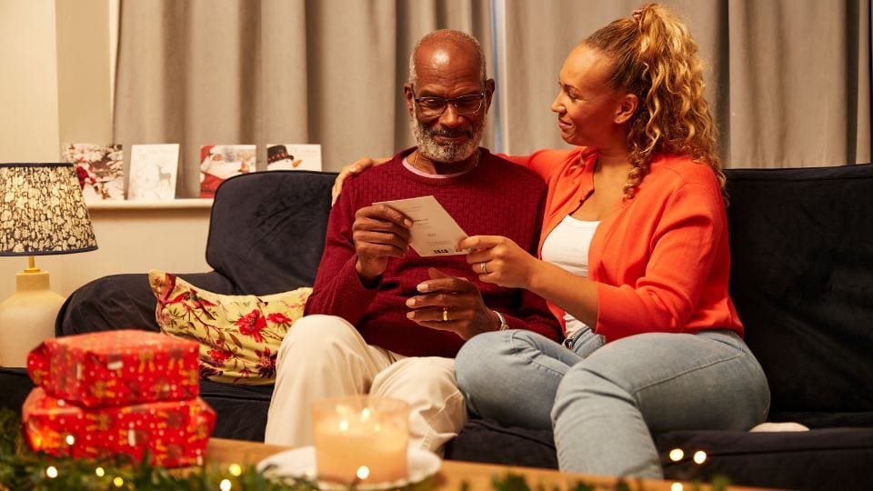 family opening christmas gifts