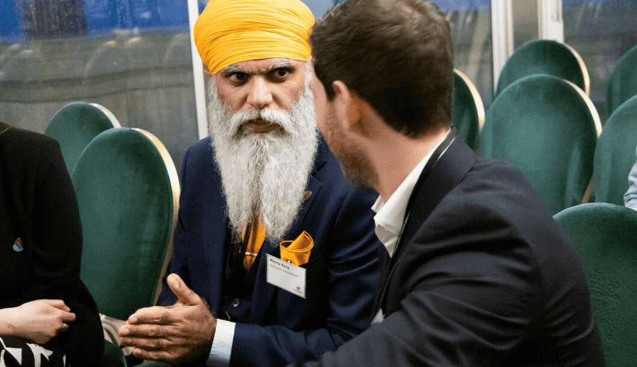 Two men talking at a Dementia UK event