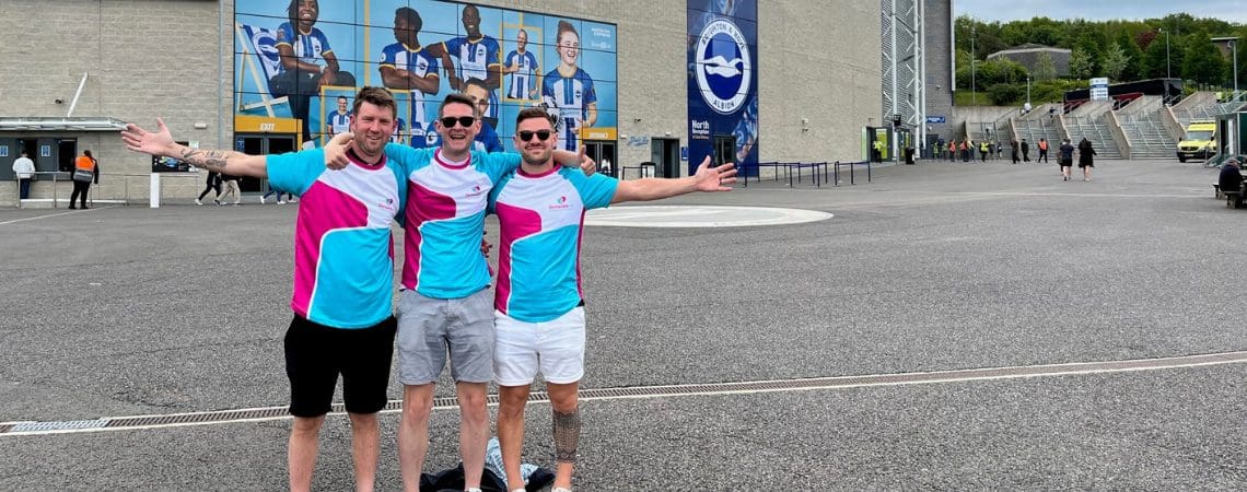 Football fans standing outside football stadium