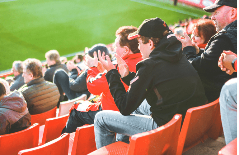 A man in the stalls at a football match