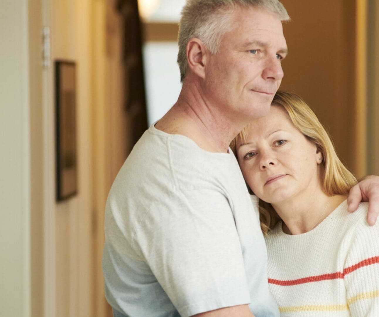 man hugging a woman