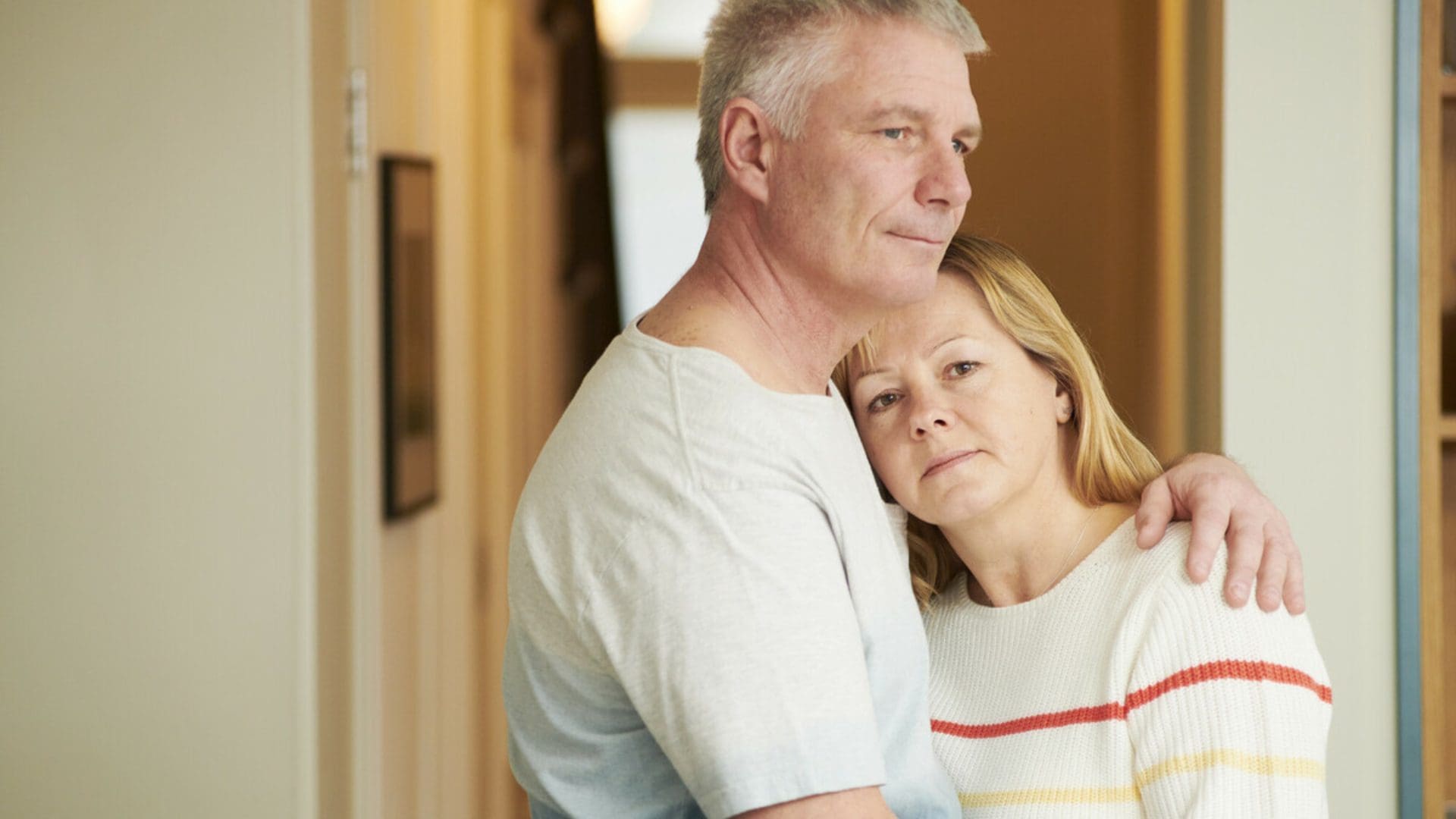 man hugging a woman